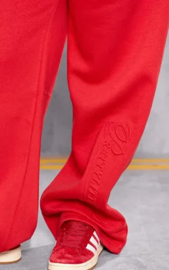 Sale PrettyLittleThing Plus Embossed Graphic Straight Leg Sweatpants Red