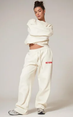 PrettyLittleThing Cream Sweatsuits*Premium Studio Print Straight Leg Sweatpants