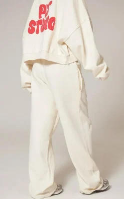 PrettyLittleThing Cream Sweatsuits*Premium Studio Print Straight Leg Sweatpants