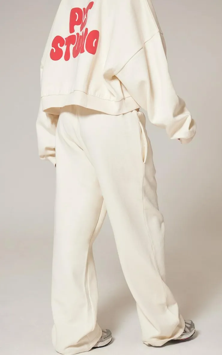 PrettyLittleThing Cream Sweatsuits*Premium Studio Print Straight Leg Sweatpants