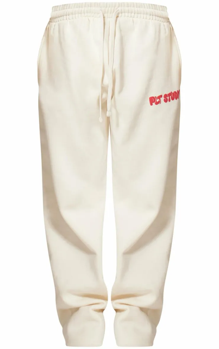 PrettyLittleThing Cream Sweatsuits*Premium Studio Print Straight Leg Sweatpants