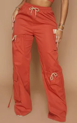 Discount PrettyLittleThing Shape Cargo Pocket Detail Wide Leg Sweatpants Rust