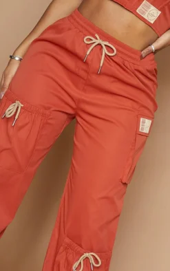 Discount PrettyLittleThing Shape Cargo Pocket Detail Wide Leg Sweatpants Rust