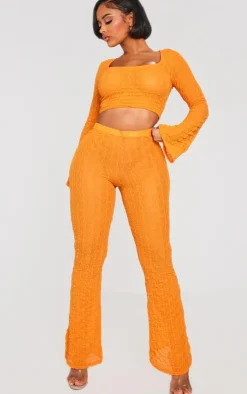 Discount PrettyLittleThing Shape Textured Sheer Wide Leg Pants Bright Orange
