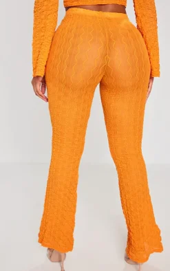 Discount PrettyLittleThing Shape Textured Sheer Wide Leg Pants Bright Orange