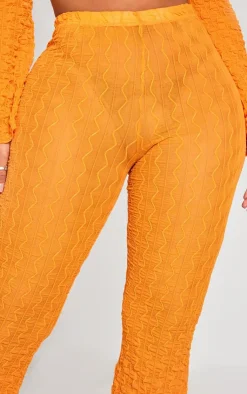 Discount PrettyLittleThing Shape Textured Sheer Wide Leg Pants Bright Orange