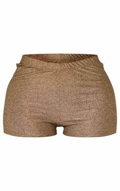 Online PrettyLittleThing Shape Glitter Lurex Mini Shorts Gold