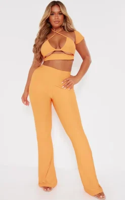Hot PrettyLittleThing Shape Slinky Low Rise Flared Pants Orange