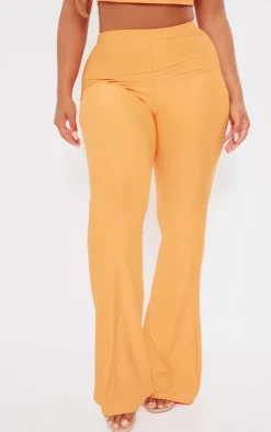 Hot PrettyLittleThing Shape Slinky Low Rise Flared Pants Orange