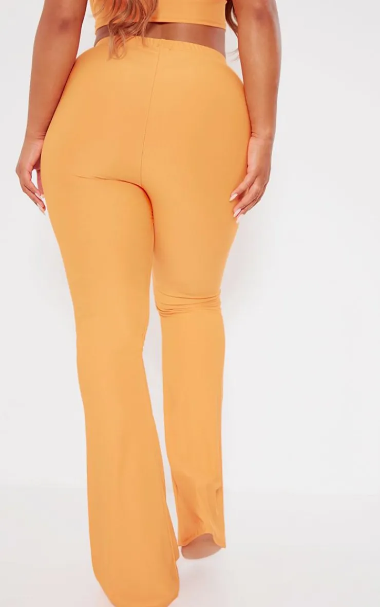 Hot PrettyLittleThing Shape Slinky Low Rise Flared Pants Orange