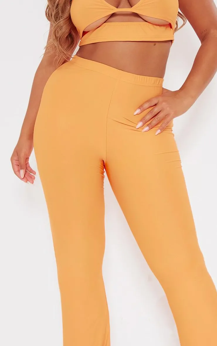 Hot PrettyLittleThing Shape Slinky Low Rise Flared Pants Orange