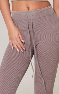 Online PrettyLittleThing Taupe Faded Snatched Rib Tie Waist Skinny Flare Pants Taupe.