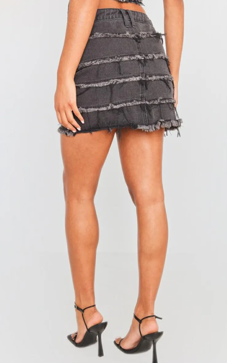 PrettyLittleThing Frayed Seam Detail Mini Denim Skirt Washed Black