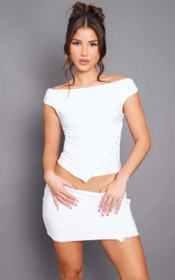 Online PrettyLittleThing Slinky Low Rise Slit Hem Eyelet Detail Micro Mini Skirt White